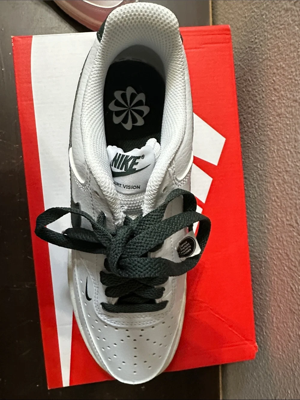 Nike White Low-Top Sneakers with Dark Green Swoosh and Heel